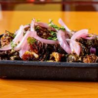 Brussels Sprouts · Pickled onions and aged balsamic.