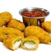 Jalapeño Poppers (6 Pcs) · Spicy, cheddar stuffed, battered and golden fried jalapeño peppers.