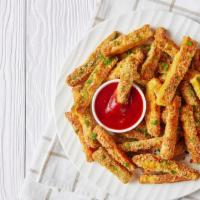 Zucchini Sticks · Fresh zucchini sticks, battered and fried until crispy and golden on the outside and tender ...
