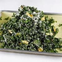 Kale Salad · Curly kale, avocado, Parmesan, pepitas, slow-cooked egg yolk dressing.
