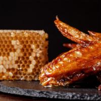 Honey BBQ Wings · Hot N' Crispy Chicken wings, tossed in Honey BBQ sauce and fried to perfection!