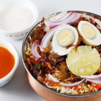 Chicken Dum Biryani(C.B) · Chicken with bones, marinated with yogurt, onions, spices, saffron, coriander and cashew, co...