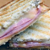 Ham & Cheese Panini · Ciabatta Bread, Turkey Ham, Monterey Cheese and
Secret recipe dressing.