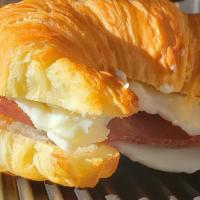 Eggs & Bacon · Croissant bread with Crispy bacon and Turkey Ham and cheese.