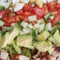 Chopped Salad · Chopped Romaine with hard boiled eggs, bacon, cucumbers, tomato, and avocado. Comes with Ran...