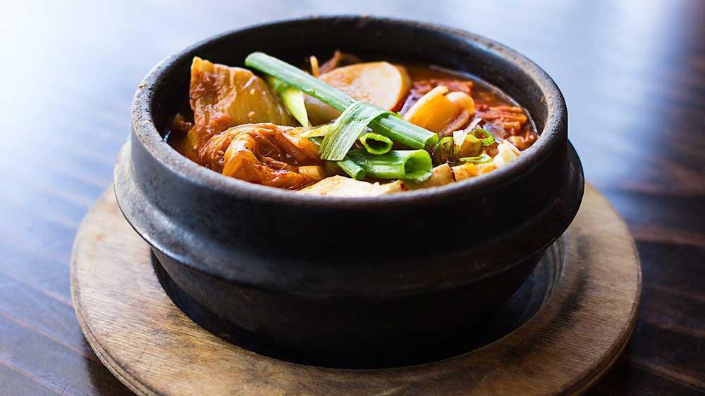 Kimchi Stew · Kimchi, rice cake, tofu, scallion, and oniln.