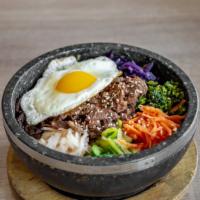 Hot Stone Pot Bibimbap (White Rice) · Fried egg, spinach, mushroom, carrot, bean sprout, etc. Choice of protein.
Rice cooked crisp...