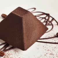 Chocolate Truffle · Chocolate gelato, caramelized hazelnuts, and topped with cocoa powder.
