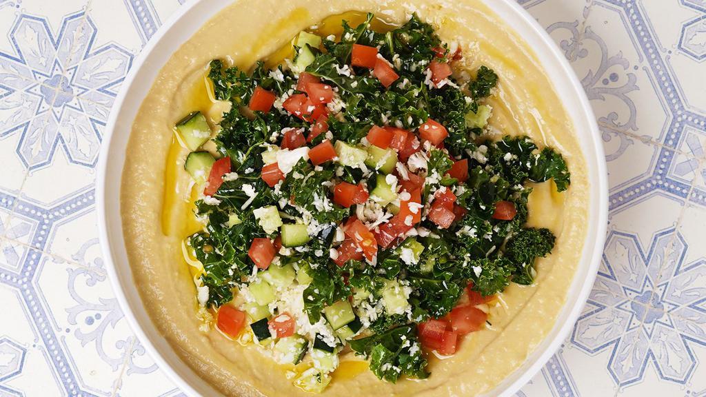 Tabbouleh Hummus Bowl · Original hummus with tabbouleh and pita.