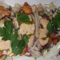 Mahi Fish Tacos · Family salad - housemade seasoned chips.