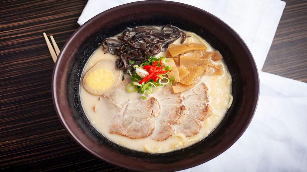 301. Tonkotsu Ramen · Milky pork bone flavor soup with sliced roasted pork, egg, bamboo stem, black fungus and green onion.