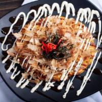 402. Okonomiyaki - Japanese Style Pancake · Top with okonomiyaki sauce, mayo and dry fish flakes.