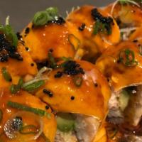 Volcano Roll · Baked salmon w/ spicy cream sauce, crab meat, avocado & tobiko