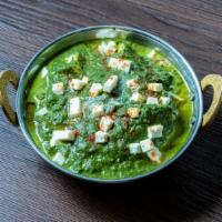 Palak Paneer · Cottage cheese cooked with blended Indian spices and spinach sauce.