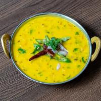 Andhra Dal · Yellow lentils and tomatoes cooked well with mild spices.