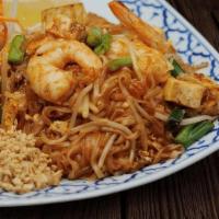 L Pad Thai · Pan fried rice noodle with shrimp, tofu, egg, bean sprouts and green onion topped with groun...