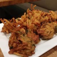 Vegetable Pakora · Vegetarian. Fried vegetable fritters. Served with homemade mint and tamarind chutney.