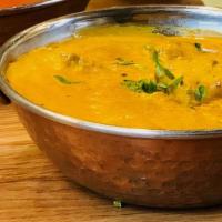 Butter Chicken · Tandoori chicken cooked in a creamy sauce with butter.