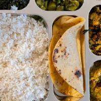 Thali · Served with a portion of roti, rice, soup, curry, fry, and dal along with condiments and swe...