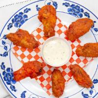Buffalo Wings · 8 Pcs wings made with spicy sauce, it is coming with one home made ranch.