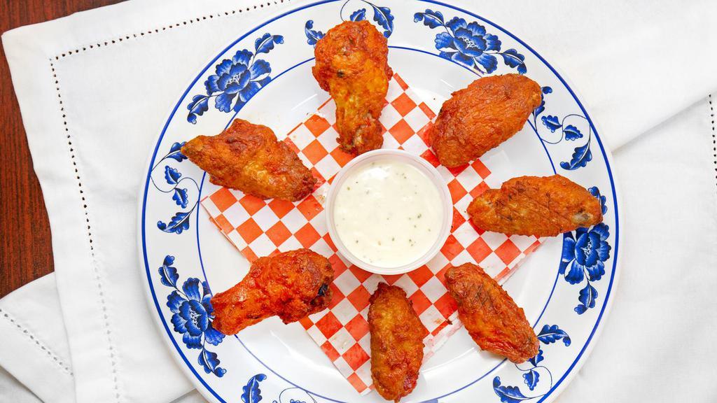 Buffalo Wings · 8 Pcs wings made with spicy sauce, it is coming with one home made ranch.