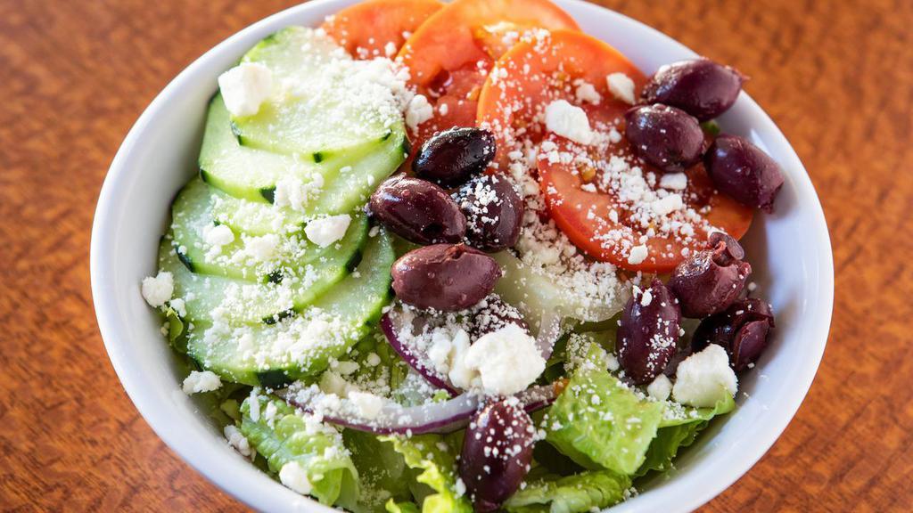 Greek Salad · Hearts of Romain, Diced tomato, kalamata olives, cucumbers, red onion, feta cheese and balsamic dressing