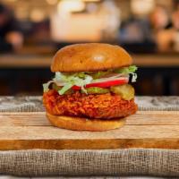 Nashville Hotbird Fried Chicken Sandwich · Crispy fried chicken, sweet and spicy slaw, sriracha mayonnaise, and Nashville hot sauce. Se...