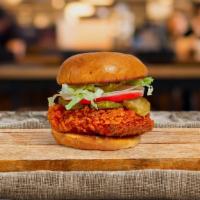 Buffalo Fried Chicken Sandwich · Crispy fried chicken, sriracha hot sauce, blue cheese, lettuce, and tomato. Served on a warm...