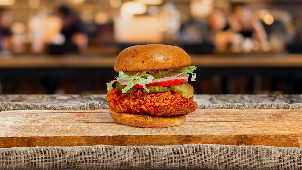 Buffalo Fried Chicken Sandwich · Crispy fried chicken, sriracha hot sauce, blue cheese, lettuce, and tomato. Served on a warm toasted bun and with a side of home cut fries and curry ketchup.