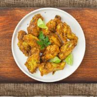 Smoky Honey Mustard Wings · (Six pieces) Fresh chicken wings fried until golden brown, and tossed in a smoky honey musta...
