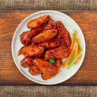 Sriracha Chicken Wings · (Six pieces) Fresh chicken wings fried until golden brown, and tossed in  sriracha, butter, ...