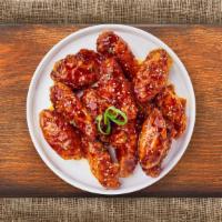Korean Chicken Wings · (Six pieces) Fresh chicken wings fried until golden brown, and tossed in soy sauce, brown su...