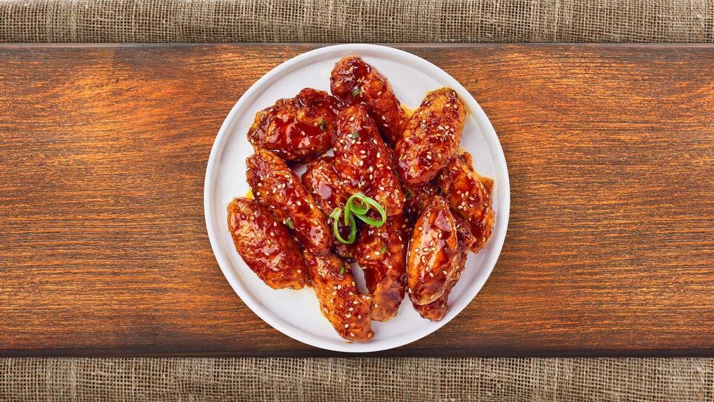 Korean Chicken Wings · (Six pieces) Fresh chicken wings fried until golden brown, and tossed in soy sauce, brown sugar, honey, and sesame seeds. Served with bleu cheese.