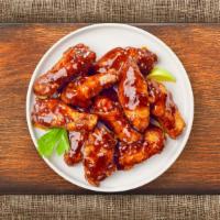 BBQ Chicken Wings · (Six pieces) Fresh chicken wings fried until golden brown, and tossed in barbecue sauce. Ser...