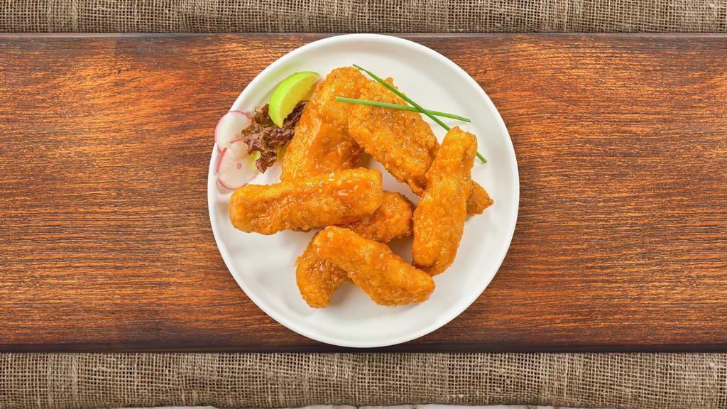 Sriracha Chicken Tenders · Chicken tenders breaded, fried until golden brown before being tossed in  sriracha, butter, lemon zest, and cilantro. Served with bleu cheese.