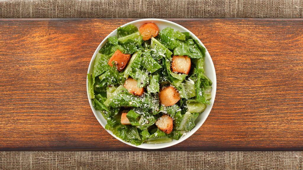 Caesar Salad · Romaine lettuce, house croutons, and parmesan cheese tossed with Caesar dressing.