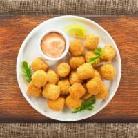 Tater Tots · (Vegetarian) Shredded Idaho potatoes formed into tots, battered, and fried until golden brow...
