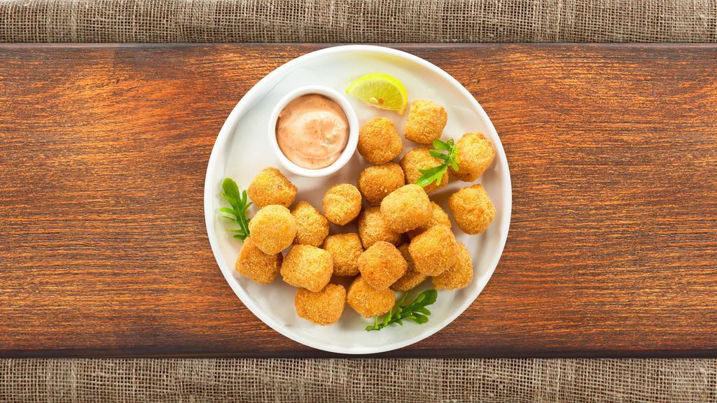 Tater Tots · (Vegetarian) Shredded Idaho potatoes formed into tots, battered, and fried until golden brown. Served with your choice of sauce.