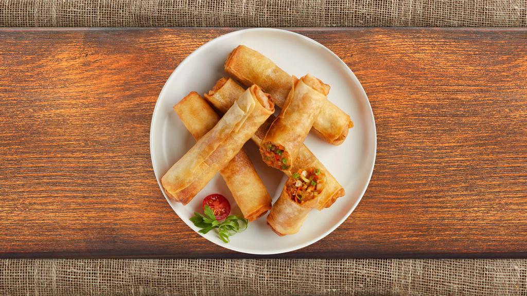 Vegetable Spring Roll · Seasonal vegetables wrapped in rice wrapper and fried until golden crisp. Served with dipping sauce.