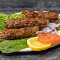 Kababich Plate · Seekh kabob beef or chicken cooked on skewer, served with chana masala, basmati rice and naa...