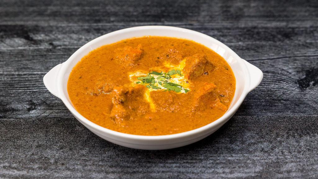 Chicken Tikka Masala · A popular village dish made from roasted marinated chicken chunks cooked in spiced tomato curry sauce.