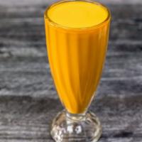 Mango Lassi · A unique shake made from mango pulp blended with Indus-made yogurt and sugar.