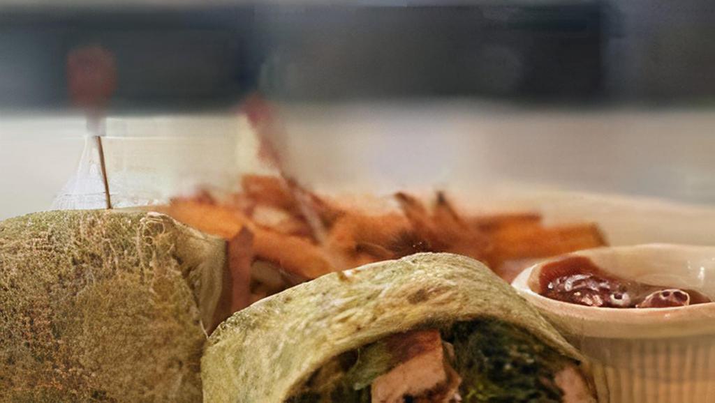 Chicken Kebab Wrap · Grilled chicken diced into cubes, cucumber, feta, romaine, Mediterranean olives, oregano, lemon aioli wrapped in our homemade wrap.
