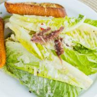 Classic Caesar · Chopped romaine leaves and tossed with Caesar dressing and topped with shaved parmesan chees...