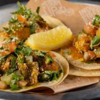 Tacos · Corn tortillas, pico kachumber, cilantro chutney, choice of protein (3 tacos)