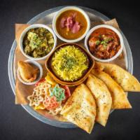 The American Punjabi Thali · Saag Paneer, daal lentils, plus the choice of ghee makhni butter chicken or paneer,(Contains...