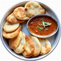 Catering Naan Bit Platter · A platter of naan bits with tikka masala dipping sauce. (Vegetarian, Serves 25)