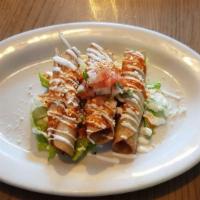 Flautas Appetizer · Rolled corn tortilla filled w/ shredded chicken, queso cotija, crema Mexicana, salsa verde
O...