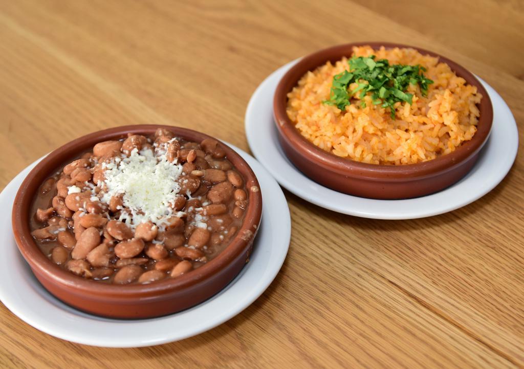 Frijoles y Arroz · Refried pinto or whole black beans // traditional Mexican rice or cilantro verde rice