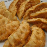 1. Goon Man Doo · Pan Fried pork dumplings (7pc)